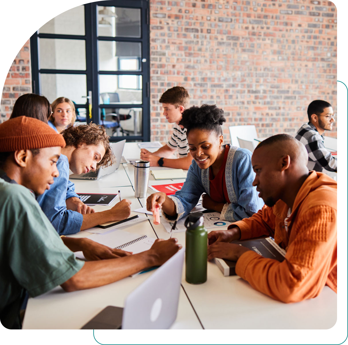 Group of people collaborating in a classroom.